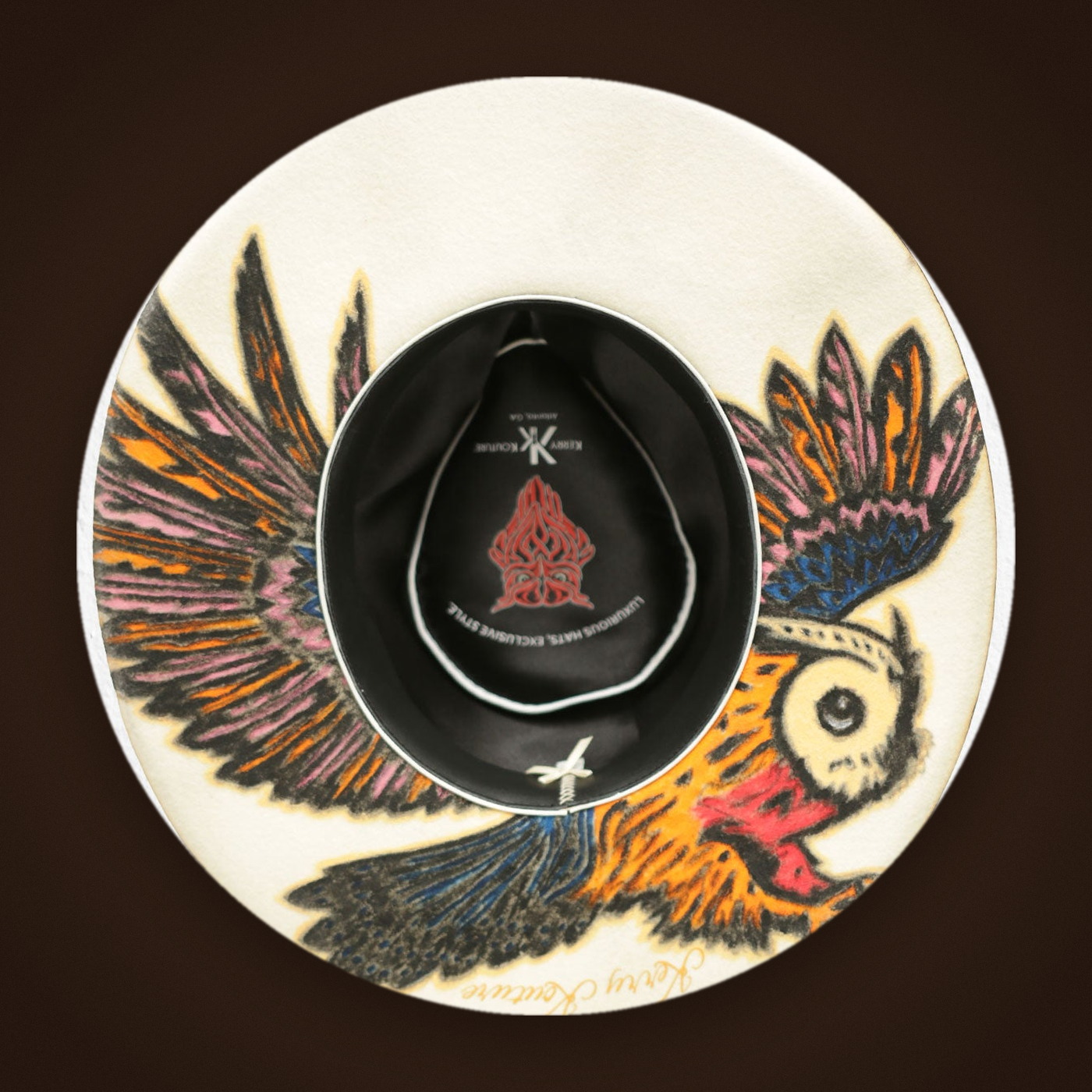 Signature owl under the bottom brim of the The Corktown