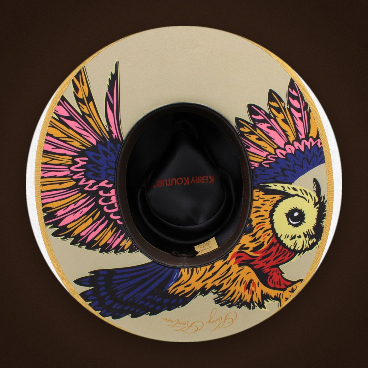 Signature owl under the bottom brim of the The Jefferson