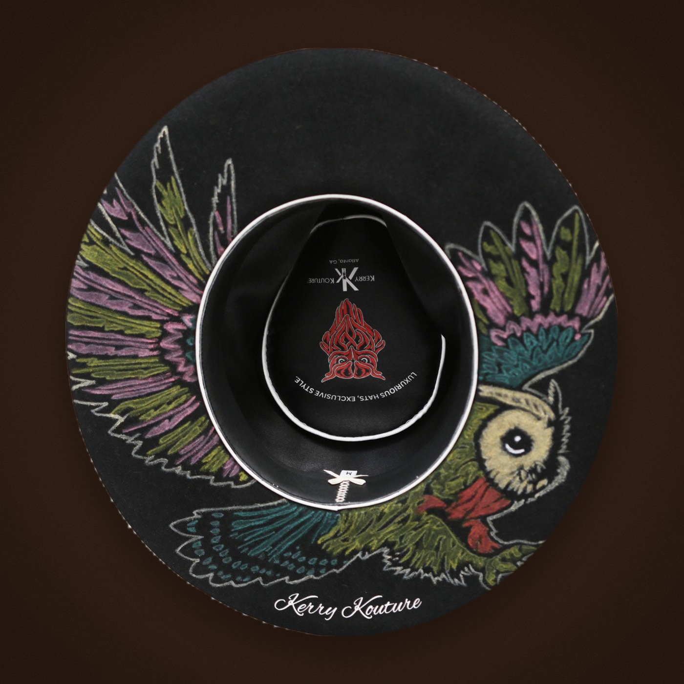 Signature owl under the bottom brim of the The Renaissance
